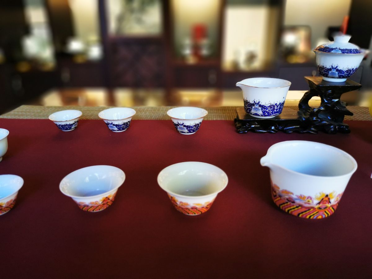 Brightly painted Jingdezhen porcelain on display — the porcelain capital where kids can throw and paint their own piece