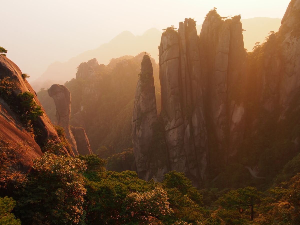 The 'Giant Python' rock pillar at Sanqingshan catching the light at sunrise, the mountain's most photographed silhouette