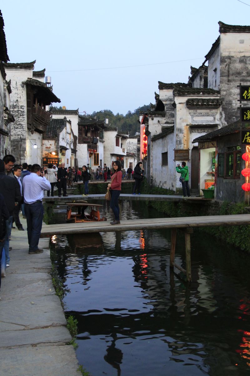 Likeng, a classic Wuyuan water village of whitewashed Huizhou houses and stone bridges along a stream