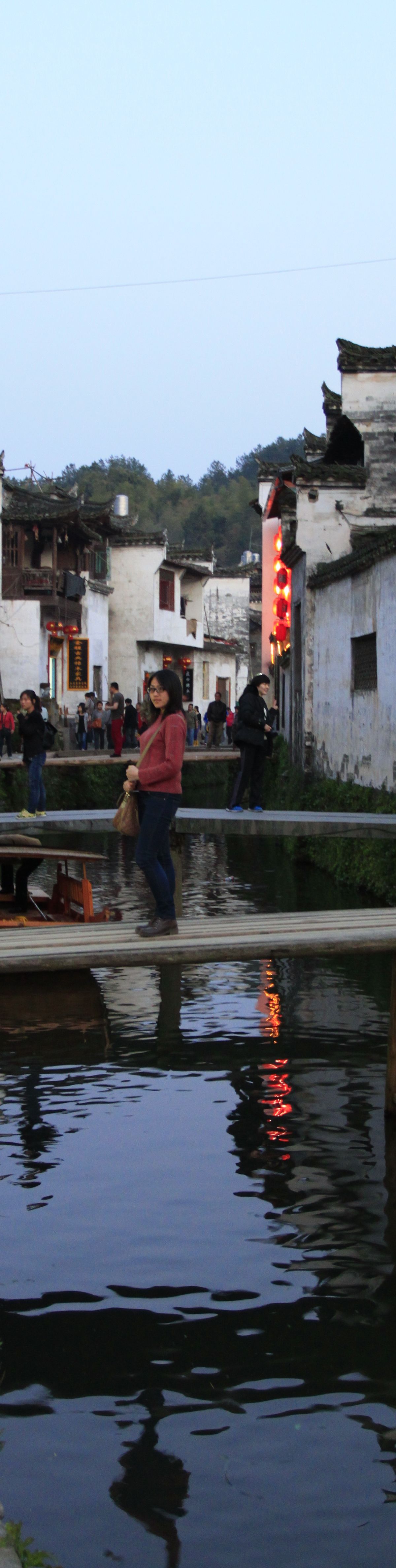 Likeng, a classic Wuyuan water village of whitewashed Huizhou houses and stone bridges along a stream