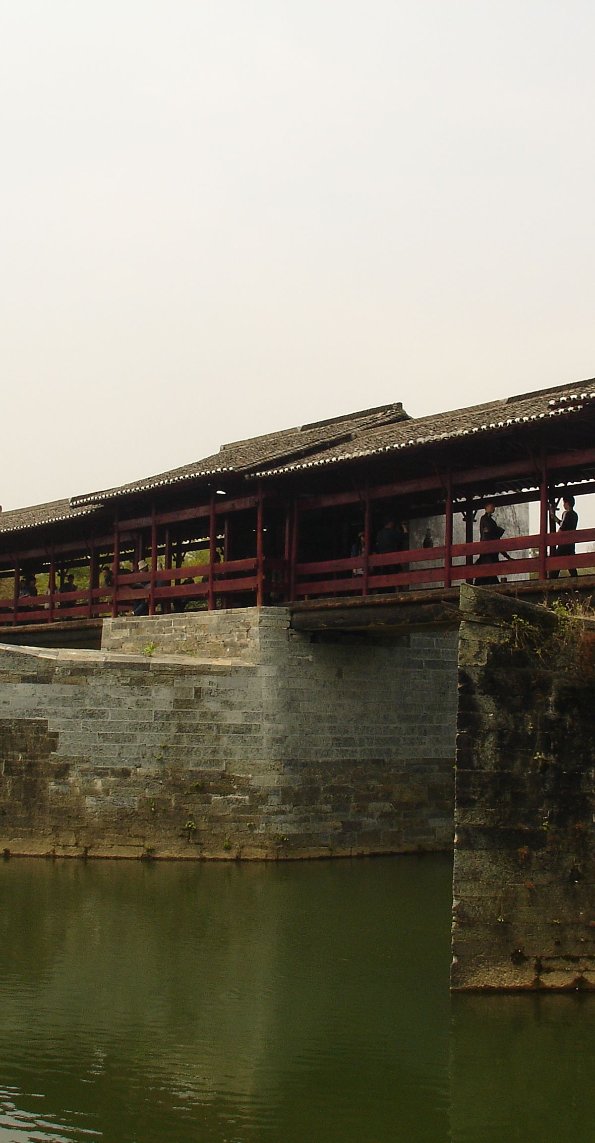 The Qinghua Rainbow Bridge (彩虹桥), a Song-dynasty covered wooden bridge spanning the river at Qinghua, Wuyuan